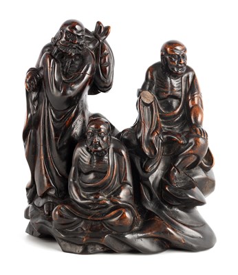 Lot 471 - AN EARLY CHINESE CARVED HEAVY HARDWOOD FIGURAL...