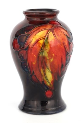 Lot 50 - A 1930S MOORCROFT SMALL INVERTED BALUSTER VASE...