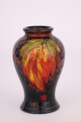 Lot 50 - A 1930S MOORCROFT SMALL INVERTED BALUSTER VASE...