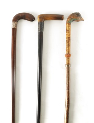 Lot 533 - THREE 19TH CENTURY WALKING STICKS comprising a...