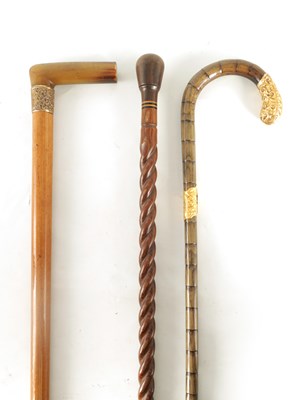 Lot 535 - THREE 19TH CENTURY WALKING STICKS comprising a...