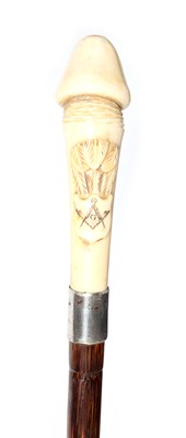 Lot 545 - A 19TH CENTURY PHALLIC IVORY HANDLED WALKING...