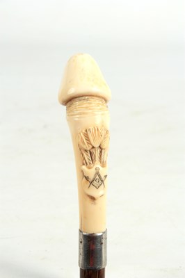 Lot 545 - A 19TH CENTURY PHALLIC IVORY HANDLED WALKING...