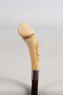 Lot 545 - A 19TH CENTURY PHALLIC IVORY HANDLED WALKING...