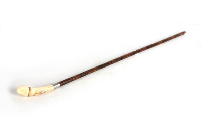 Lot 545 - A 19TH CENTURY PHALLIC IVORY HANDLED WALKING...