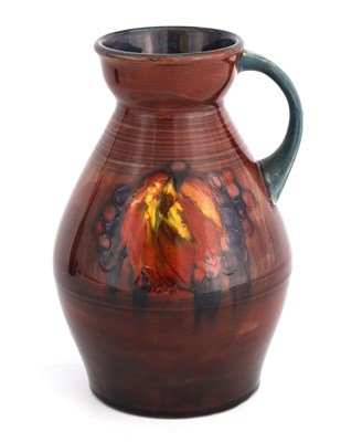 Lot 56 - A MOORCROFT OVOID TAPERING JUG WITH OGEE NECK...