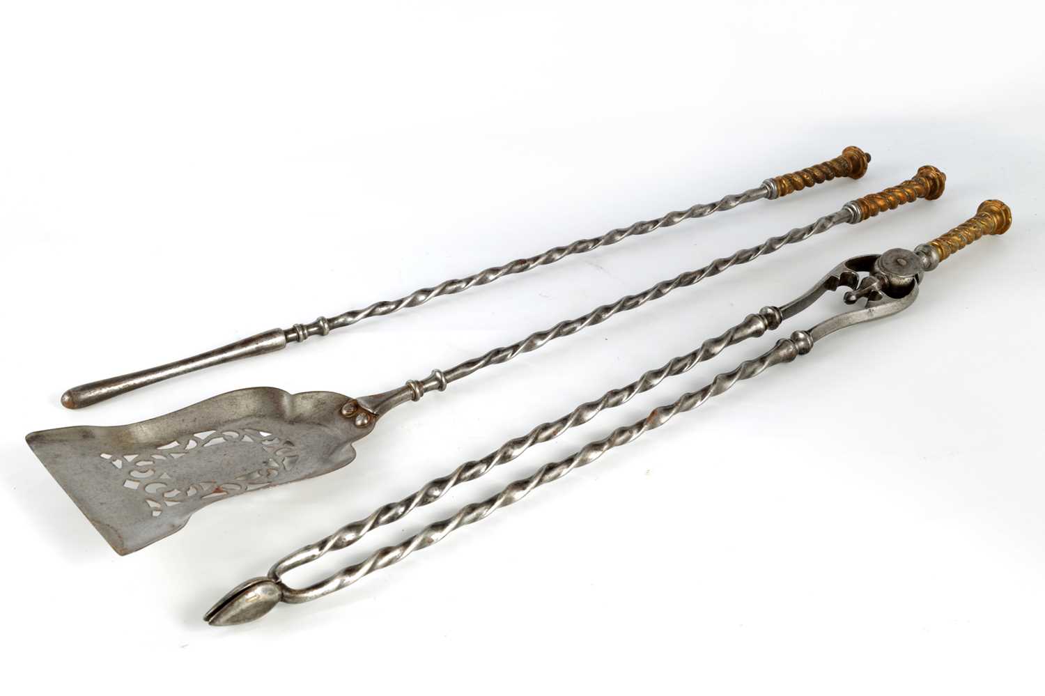 Lot 589 A SET OF REGENCY STEEL AND BRASS FIRE IRONS