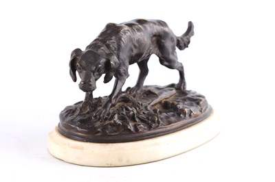 Lot 621 - A LATE 19TH CENTURY PATINATED BRONZE DOG...