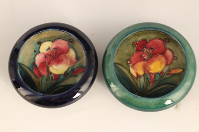 Lot 64 - TWO MOORCROFT SHALLOW SMALL DISHES WITH CURVED...