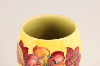 Lot 81 - A WALTER MOORCROFT SMALL FOOTED OVOID VASE...