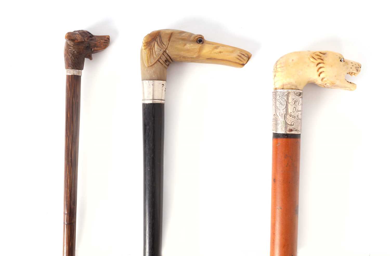 Lot 396 - THREE 19TH CENTURY ANIMAL HEAD WALKING STICKS