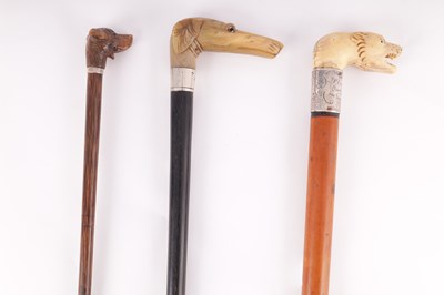 Lot 396 - THREE 19TH CENTURY ANIMAL HEAD WALKING STICKS