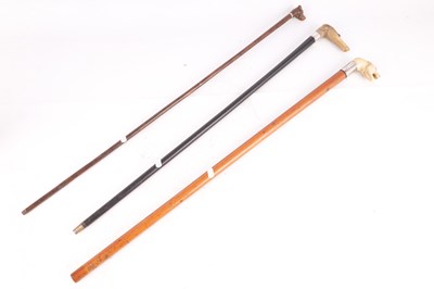 Lot 396 - THREE 19TH CENTURY ANIMAL HEAD WALKING STICKS