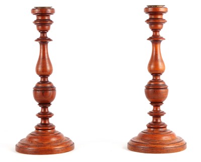 Lot 651 - A PAIR OF 19TH CENTURY TURNED OAK CANDLESTICKS