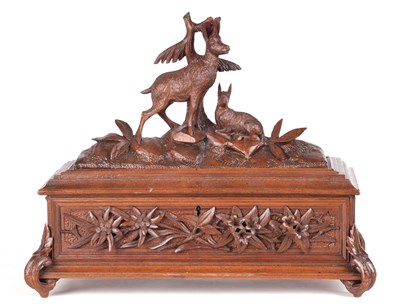 Lot 445 - AN EARLY 20TH CENTURY CARVED BLACK FOREST JEWELLERY BOX