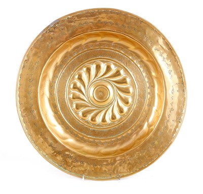 Lot 611 - A 16TH CENTURY NUREMBERG BRASS ALMS DISH