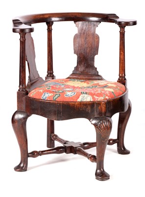 Lot 1053 - AN UNUSUAL GEORGE I WALNUT CORNER CHAIR WITH A ROUNDED FRAME