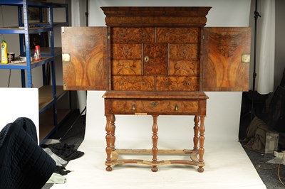 Lot 992 - A WILLIAM AND MARY HERRING-BANDED BURR WALNUT CABINET ON STAND