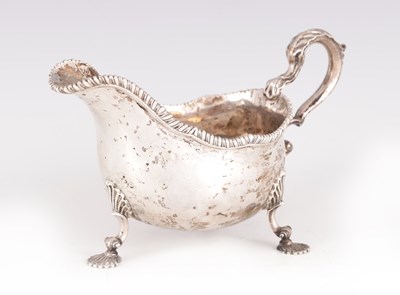 Lot 300 - AN EARLY GEORGE III SILVER SAUCE BOAT