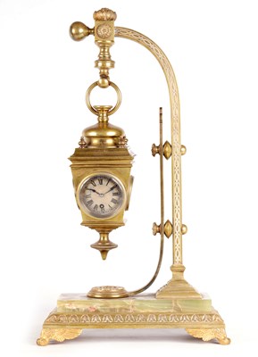 Lot 913 - AN UNUSUAL LATE 19TH CENTURY FRENCH BRASS AND ONYX NOVELTY MANTEL CLOCK