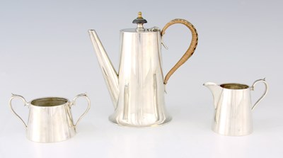 Lot 313 - A 1920'S SILVER THREE PIECE TEA SET