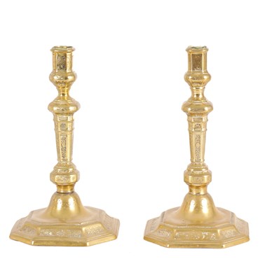 Lot 624 - A PAIR OF 18TH CENTURY FRENCH ENGRAVED BRASS CANDLESTICKS