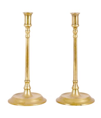 Lot 616 - A PAIR OF LATE GEORGIAN  BRASS CANDLESTICKS