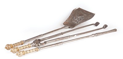 Lot 615 - A SET OF THREE REGENCY BRONZE AND POLISHED STEEL FIRE IRONS