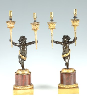 Lot 542 - A PAIR OF FRENCH PATINATED BRONZE, ORMOLU AND ROUGE MARBLE FIGURAL CANDELABRA