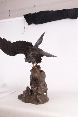 Lot 130 - AN IMPRESSIVE MEIJI PERIOD JAPANESE PATINATED BRONZE AND GILT HIGHLIGHTED SCULPTURE OF AN EAGLE