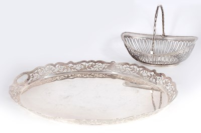 Lot 299 - A LARGE OVAL SILVER PLATED TRAY TOGETHER WITH AN OLD SHEFFIELD PLATE BASKET
