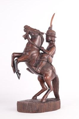Lot 105 - A CHINESE CARVED HARDWOOD FIGURE OF A GENERAL ON HORSE BACK