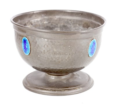 Lot 477 - AN ARTS AND CRAFTS PLANISHED PEWTER BOWL SET WITH RUSKIN STYLE BLUE ENAMEL MEDALLIONS