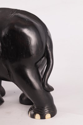Lot 224 - A LARGE LATE 19TH CENTURY ANGLO-INDIAN CARVED EBONY ELEPHANT