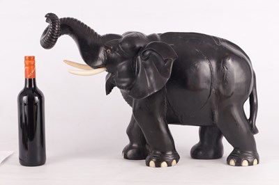 Lot 224 - A LARGE LATE 19TH CENTURY ANGLO-INDIAN CARVED EBONY ELEPHANT