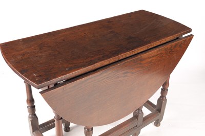 Lot 978 - AN 18TH CENTURY OAK GATE LEG TABLE OF SMALL SIZE