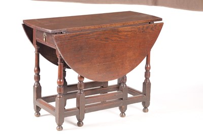 Lot 978 - AN 18TH CENTURY OAK GATE LEG TABLE OF SMALL SIZE