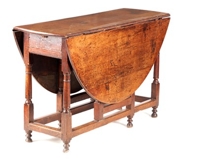 Lot 993 - A GEORGE III OAK GATE LEG TABLE