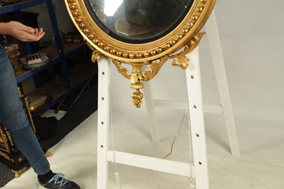 Lot 1026 - A REGENCY CARVED GILTWOOD CONVEX MIRROR OF LARGE SIZE