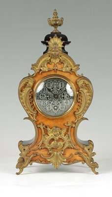 Lot 864 - A LATE 19TH CENTURY GERMAN EBONISED AND WALNUT FRONTED ORNATE GILT METAL MOUNTED MANTEL CLOCK IN THE ROCOCO STYLE