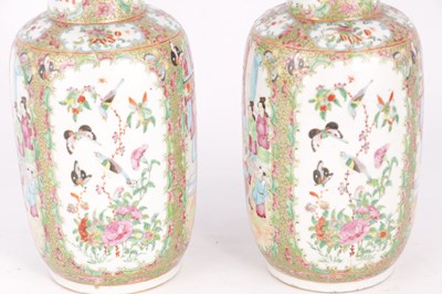 Lot 107 - A PAIR OF 19TH CENTURY CHINESE CANTON PORCELAIN VASES WITH SLENDER NECKS
