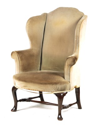 Lot 1023 - A GEORGE II MAHOGANY WINGBACK UPHOLSTERED ARMCHAIR