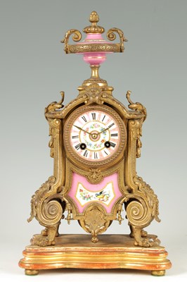 Lot 936 - A 19TH CENTURY FRENCH GILT METAL AND PORCELAIN PANELLED MANTEL CLOCK