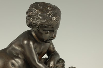 Lot 662 - A 19TH CENTURY BRONZE SCULPTURE OF A SEATED CHERUB HOLDING A BUTTERFLY