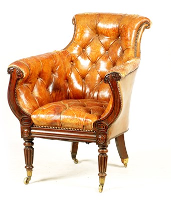 Lot 1027 - A LATE REGENCY ROSEWOOD FRAMED AND STUDDED TAN LEATHER UPHOLSTERED LIBRARY CHAIR