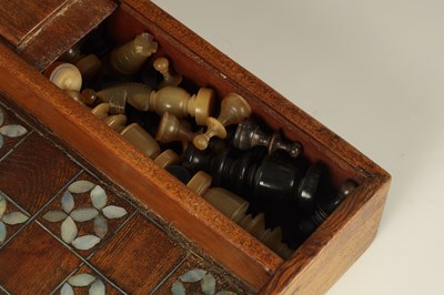 Lot 181 - A 19TH CENTURY INDIAN RHINOCEROS HORN CHESS AND DRAUGHTS SET