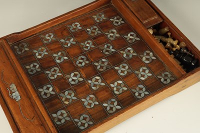 Lot 181 - A 19TH CENTURY INDIAN RHINOCEROS HORN CHESS AND DRAUGHTS SET