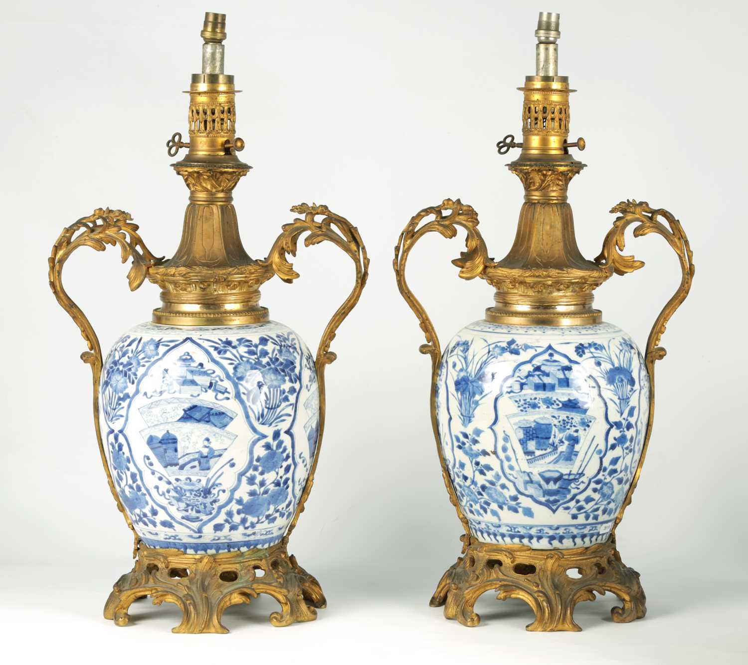Lot 128 - A LARGE MATCHED PAIR OF 18TH CHINESE BLUE AND WHITE GINGER JARS, LATER CONVERTED TO LAMPS