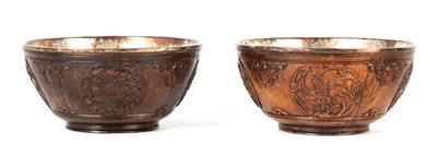 Lot 524 - A PAIR OF 19TH CENTURY CARVED COCONUT AND SILVERED METAL BOWLS