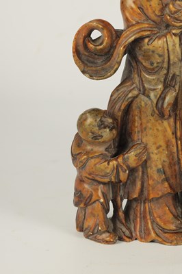 Lot 137 - A CHINESE CARVED SOAP STONE FIGURAL STATUE